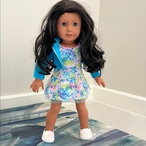 American Girl Doll with Blue Jacket & floral dress. 2017